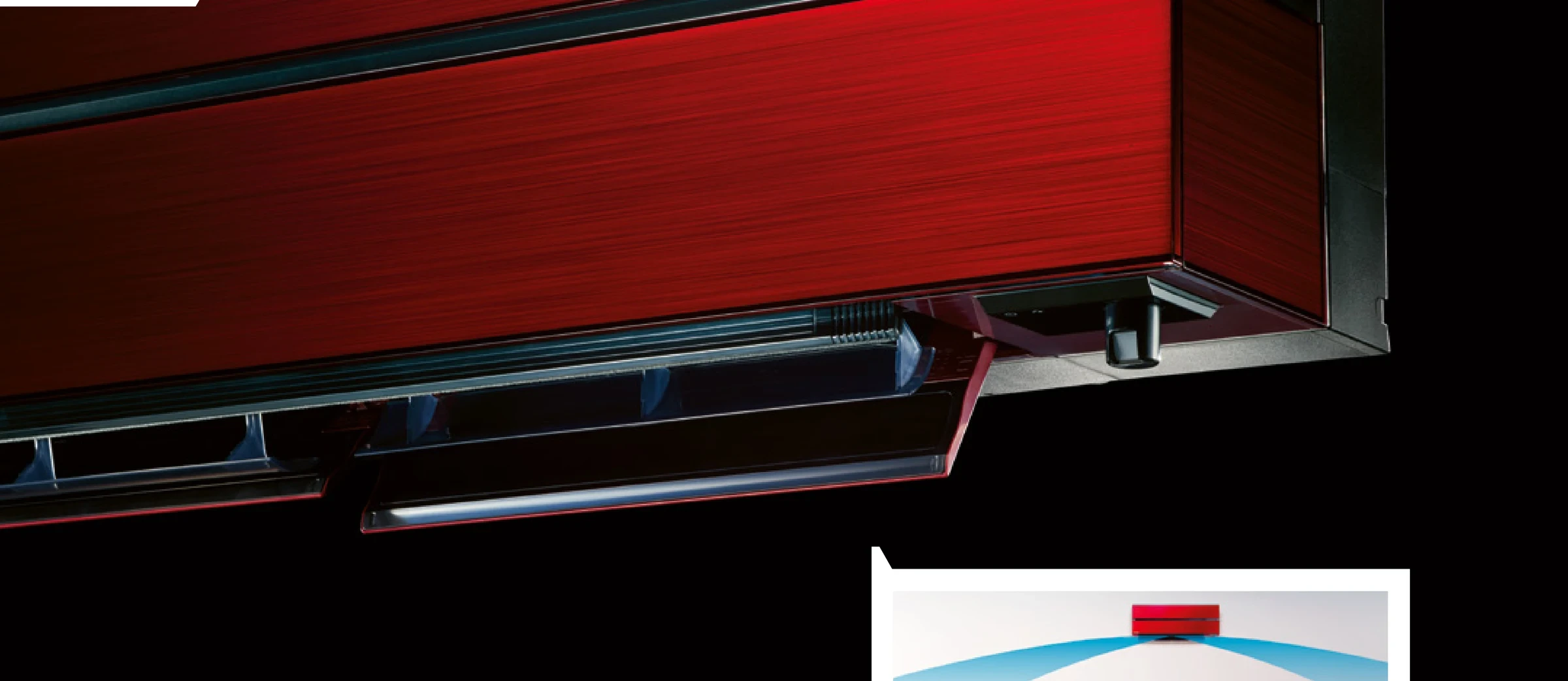 Nahaufnahme des Diamond Wandgeräts in Ruby Red mit sichtbaren Ausblaslamellen und 3D i-see Sensor